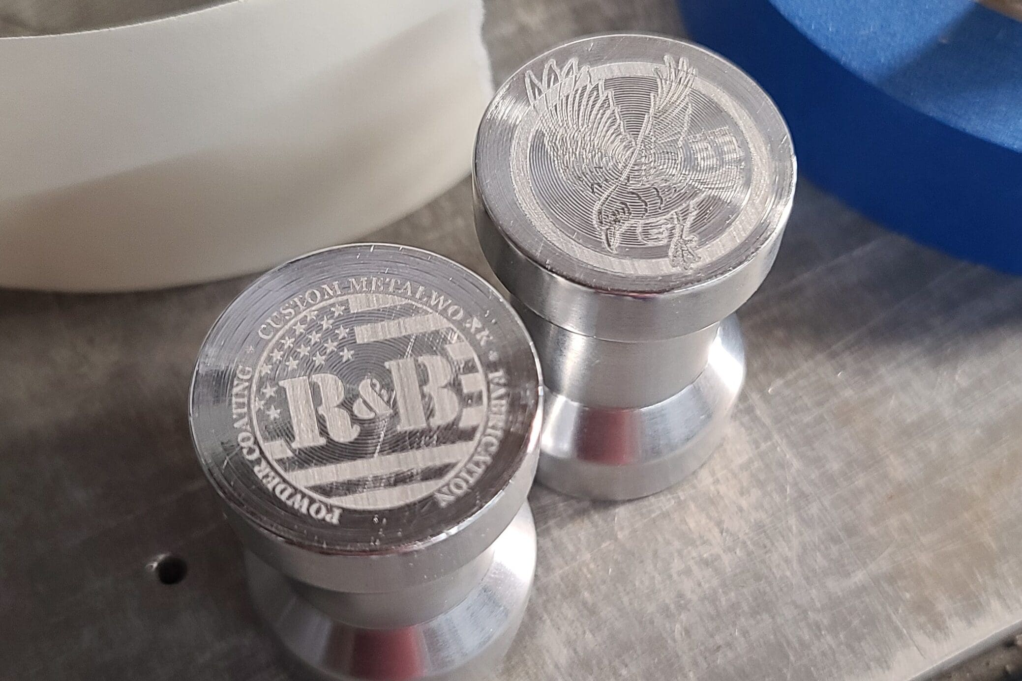 A couple of metal containers sitting on top of a table.