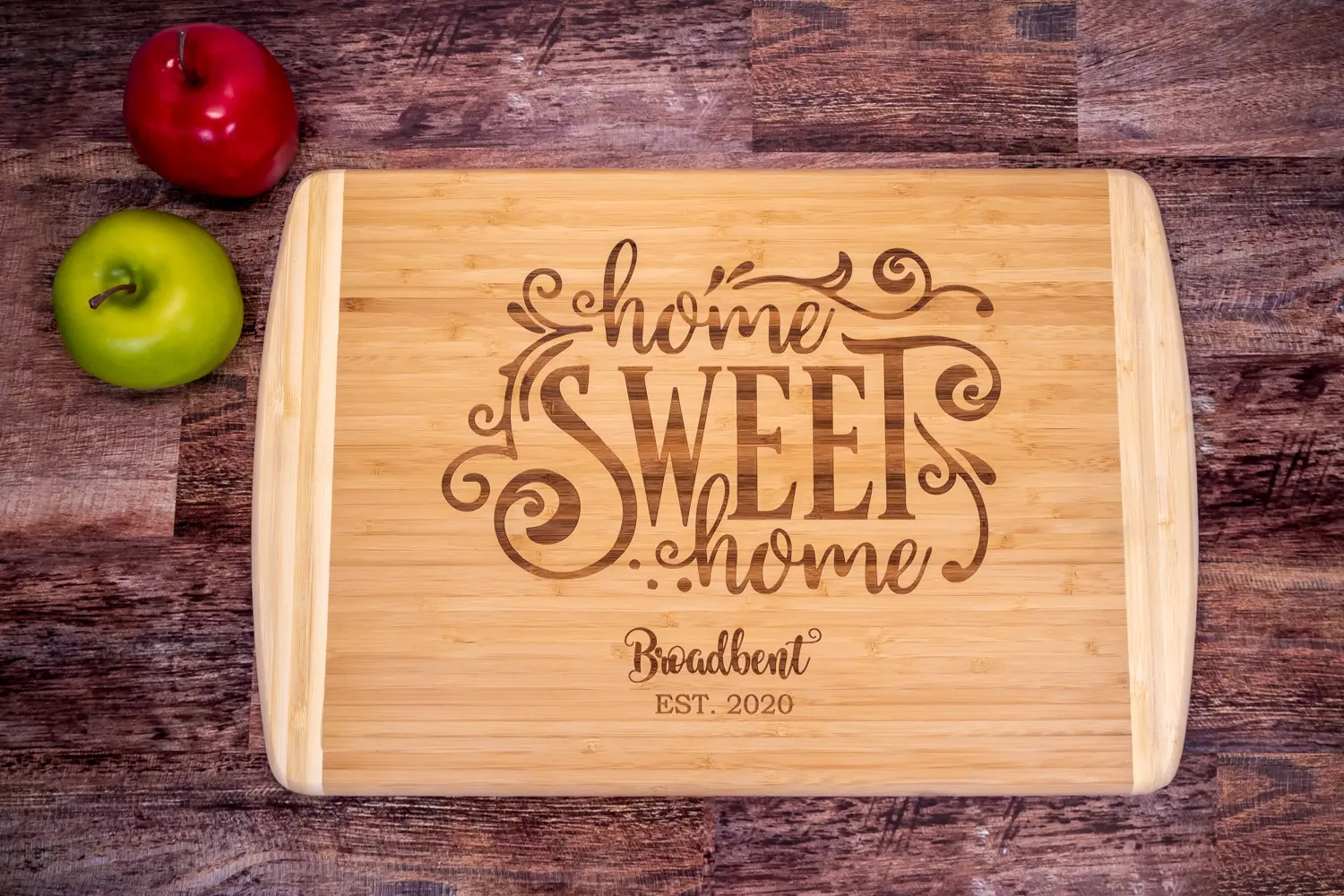 A cutting board with the words " home sweet home ".