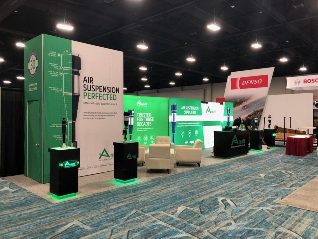 A convention room with green and white banners.