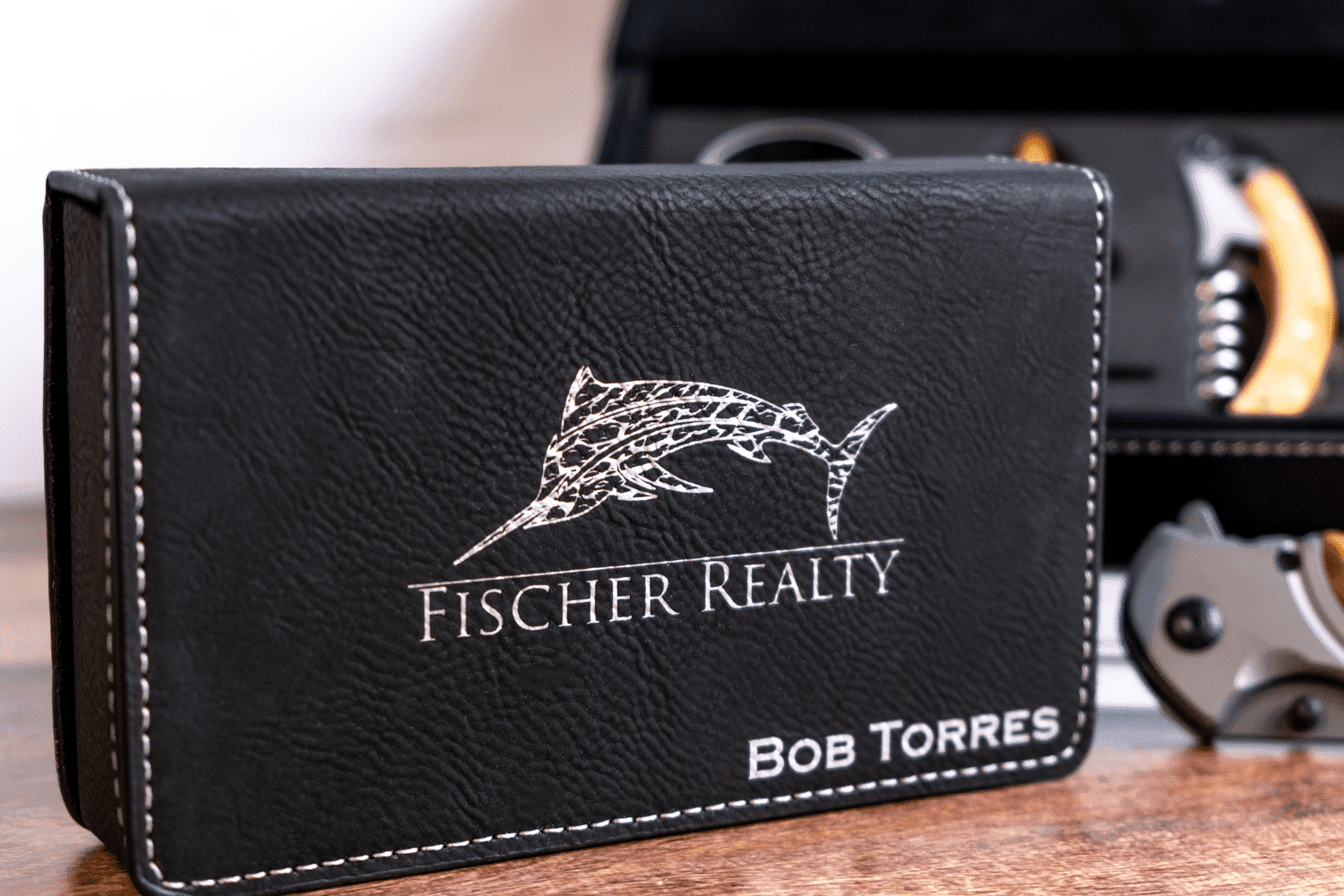 A business card holder with the name of a real estate agent.