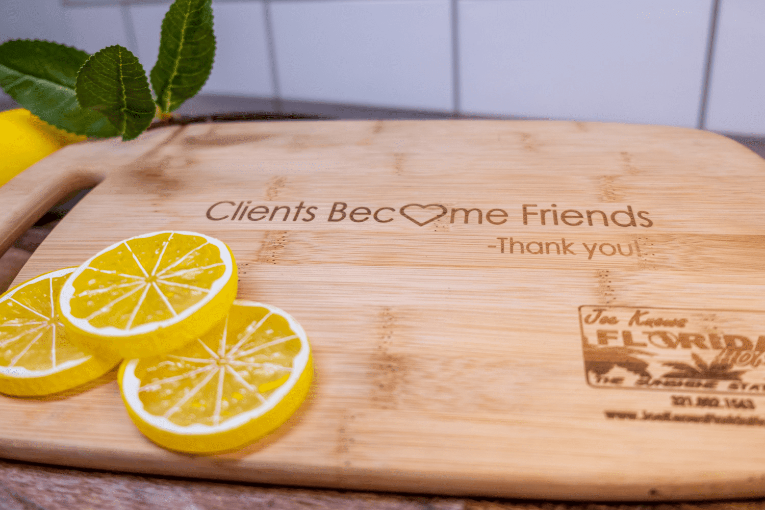 A cutting board with lemons on it